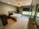 Comfortable primary bedroom showcases neutral decor, ceiling fan, and great natural light at 5506 Malta St, Denver, CO 80249