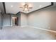 Spacious bedroom with an ensuite bathroom boasts neutral paint and lots of natural light at 5506 Malta St, Denver, CO 80249