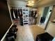 This large walk-in closet has installed shelving and lots of room for storage and organization at 5506 Malta St, Denver, CO 80249