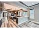 Spacious kitchen with modern gray cabinets, stainless steel appliances, granite countertops, and stylish flooring at 5506 Malta St, Denver, CO 80249