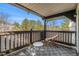 Balcony offers outdoor seating with serene views of the surrounding trees at 17493 E Mansfield Ave # 1231L, Aurora, CO 80013