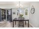 Light-filled dining area with views, light floors, and access to the private balcony at 17493 E Mansfield Ave # 1231L, Aurora, CO 80013