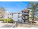 Multi-level building features balconies and landscaping at 17493 E Mansfield Ave # 1231L, Aurora, CO 80013