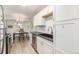 Spacious kitchen with stainless steel appliances, white cabinets, and lots of natural light at 17493 E Mansfield Ave # 1231L, Aurora, CO 80013