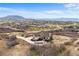 Aerial view of the house, horse barn and fenced in area in a desirable community at 3074 Castle Butte Dr, Castle Rock, CO 80109