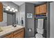 Cozy bathroom with a single sink, cabinet, and a mirror, creating a functional space at 3074 Castle Butte Dr, Castle Rock, CO 80109