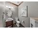 Stylish powder room with a vessel sink, decorative mirror, and modern fixtures at 3074 Castle Butte Dr, Castle Rock, CO 80109