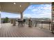 A covered deck with stone columns offers stunning mountain views and a relaxing outdoor space at 3074 Castle Butte Dr, Castle Rock, CO 80109