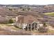 House with the back porch showing in a neighborhood with scattered houses in the background at 3074 Castle Butte Dr, Castle Rock, CO 80109