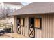 Two horses peer out from their wooden stalls at 3074 Castle Butte Dr, Castle Rock, CO 80109