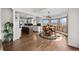 Bright kitchen features an island, stainless appliances, modern pendant lights, and an adjacent dining area at 3074 Castle Butte Dr, Castle Rock, CO 80109