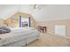 Bright bedroom with vaulted ceiling, fan and a large window with curtains at 6987 Esperanza Dr, Castle Pines, CO 80108