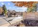 Community entrance gate with stone signage, landscaping, and secure entry system at 6987 Esperanza Dr, Castle Pines, CO 80108