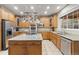 Spacious kitchen with stainless steel appliances, granite countertops, and a central island with gas range at 6987 Esperanza Dr, Castle Pines, CO 80108