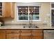 Granite counters and stainless steel appliances provide a modern aesthetic in this well-appointed kitchen at 6987 Esperanza Dr, Castle Pines, CO 80108