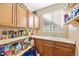 A functional pantry offers ample storage with plenty of shelves and a sink for added convenience at 6987 Esperanza Dr, Castle Pines, CO 80108