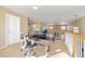 Upstairs loft used as an office with two monitors and desk, with view of the living room below at 6987 Esperanza Dr, Castle Pines, CO 80108