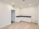 Basement featuring hardwood floors, a sink with countertops, and ample lighting at 7199 Waterleaf Trl, Littleton, CO 80125