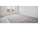 Bright bedroom with large windows overlooking the neighborhood, neutral carpet and walls at 2222 Flower Blossom Ave, Brighton, CO 80601