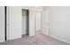 Bedroom featuring a closet with sliding doors and access to other rooms at 2222 Flower Blossom Ave, Brighton, CO 80601