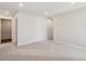 Bright bedroom featuring neutral carpet and walls, illuminated by recessed lighting at 2222 Flower Blossom Ave, Brighton, CO 80601