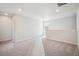 Spacious bonus room with ample lighting and plush carpeting, ideal for a playroom or entertainment area at 2222 Flower Blossom Ave, Brighton, CO 80601