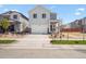 Charming two-story home featuring a neutral color palette and an attached two-car garage at 2222 Flower Blossom Ave, Brighton, CO 80601