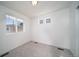 This bedroom offers a spacious layout with neutral paint and great natural light at 13583 E 103Rd Ave, Commerce City, CO 80022
