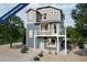 New construction home with modern gray siding, a quaint balcony, and low maintenance gravel landscaping at 13583 E 103Rd Ave, Commerce City, CO 80022
