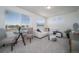 Living area features neutral paint, carpet and large windows offering lots of natural light at 13583 E 103Rd Ave, Commerce City, CO 80022