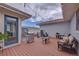 Outdoor back deck with string lights, a grill, and plenty of seating area at 15818 W 95Th Ave, Arvada, CO 80007