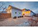 Backyard with stone walkway, privacy fence, professional landscaping and exterior lighting at 15818 W 95Th Ave, Arvada, CO 80007