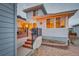 Backyard patio area with string lights, built-in grill, and a stone patio with nice landscaping at 15818 W 95Th Ave, Arvada, CO 80007