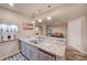 Basement bar featuring a granite countertop, sink, and stainless steel dishwasher at 15818 W 95Th Ave, Arvada, CO 80007