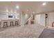 Spacious finished basement with a wet bar, built-in lights, and stairs at 15818 W 95Th Ave, Arvada, CO 80007