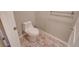 Small bathroom featuring a low-flow toilet and faux-wood tiled floor at 15818 W 95Th Ave, Arvada, CO 80007