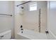 Modern bathroom featuring a tiled tub and shower combination with matte black hardware accents at 15818 W 95Th Ave, Arvada, CO 80007