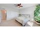 Peaceful bedroom offers natural light, a spacious closet, and cozy carpeting throughout at 15818 W 95Th Ave, Arvada, CO 80007