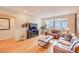 Inviting living room with hardwood floors, natural light, and stylish decor at 15818 W 95Th Ave, Arvada, CO 80007