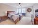 Relaxing main bedroom with comfortable bedding, neutral decor, and a view of the outdoors at 15818 W 95Th Ave, Arvada, CO 80007