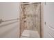 Shower with frameless glass door and decorative tile, offering a modern spa-like experience at 15818 W 95Th Ave, Arvada, CO 80007