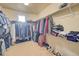 Large walk-in closet with built-in shelving providing ample storage space at 15818 W 95Th Ave, Arvada, CO 80007