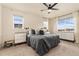 Bright bedroom with big windows, natural light, carpet flooring, and modern lamps at 3081 Youngheart Way, Castle Rock, CO 80109