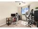 Bright room with two desks, two chairs, two computers, and a window with natural light at 3081 Youngheart Way, Castle Rock, CO 80109