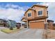 Two story home with two car garage, covered porch and xeriscaped front yard at 3081 Youngheart Way, Castle Rock, CO 80109