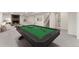 Finished basement with a billiards room, fireplace, and comfortable lounge area at 6448 Ingalls Ct, Arvada, CO 80003