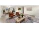 Bright living room featuring modern decor, hardwood floors, and ample natural light at 6448 Ingalls Ct, Arvada, CO 80003