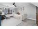 Charming bedroom featuring a comfortable bed, a built-in bookcase, and a window with natural light at 7225 Box Canyon Rd, Sedalia, CO 80135