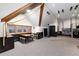 Open bonus room with exposed beams, climbing rope, a punching bag, and climbing rings at 7225 Box Canyon Rd, Sedalia, CO 80135