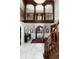 Grand foyer with marble flooring, ornate staircase, and a striking chandelier creates an elegant entry at 7225 Box Canyon Rd, Sedalia, CO 80135
